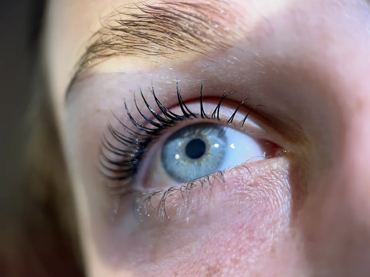 Lifted lashes on a blue eye, close-up